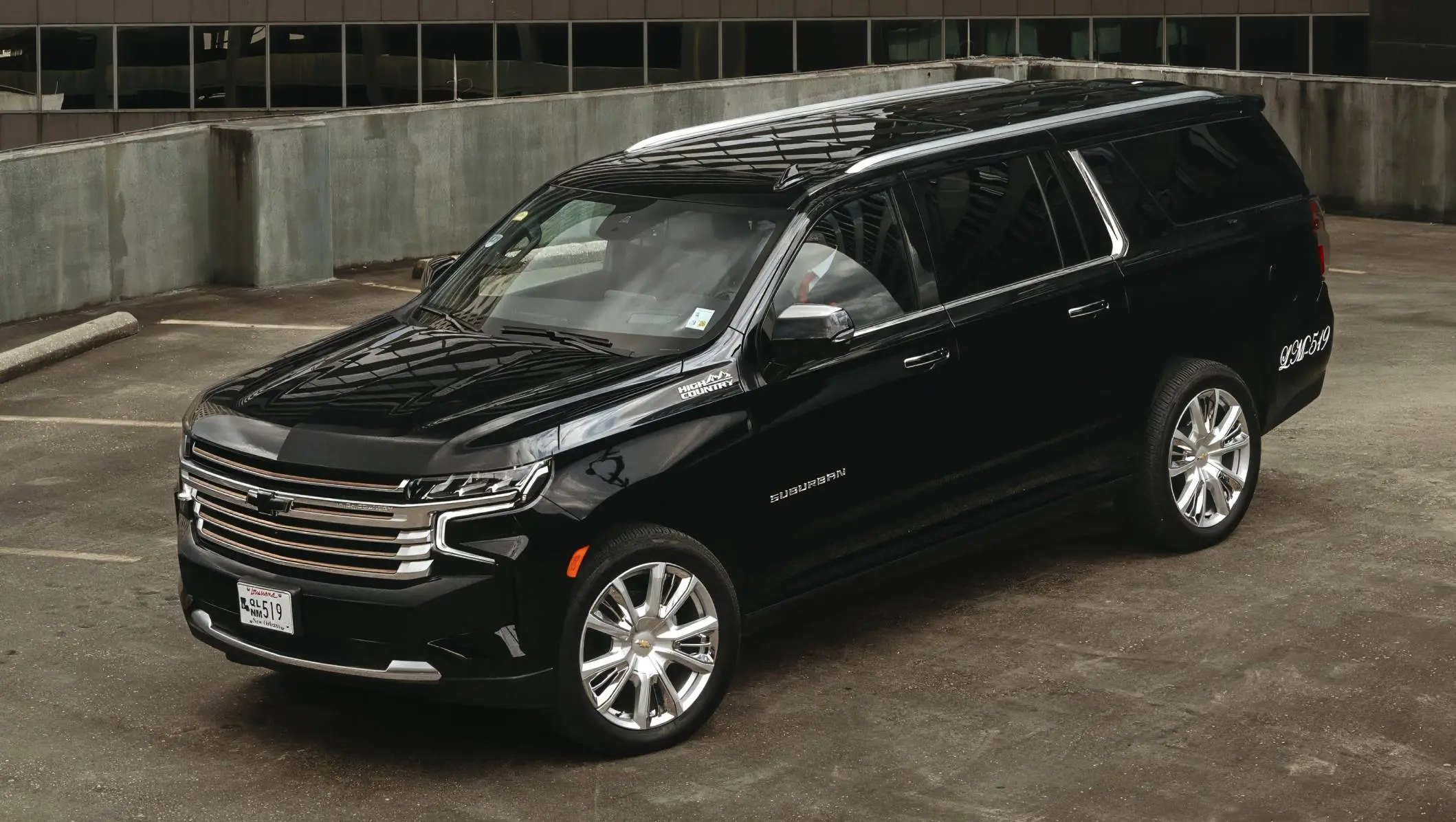 A black suv parked in the parking lot.